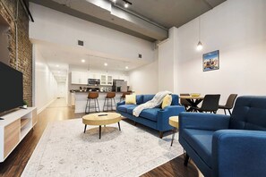 This beautifully living room offers a mix of modern style and homey comfort.