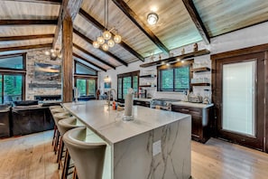 Kitchen: Upper floor, drip coffee maker, Crockpot, waffle maker, blender, toaster, cooking utensils, tableware