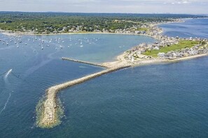 Aerial view of Scituate Lighthouse and the quiet street where this home is located