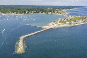 Aerial view of Scituate Lighthouse and the quiet street where this home is located