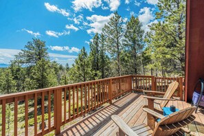 Soak in the serenity from the spacious deck, surrounded by towering pines and mountain air—perfect for sipping coffee, stargazing, or simply unwinding in nature.








