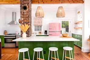 Grab a stool at the large island for morning coffee or cocktails while dinner’s cooking.