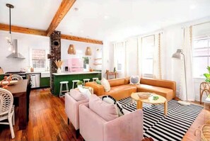 Spacious layout with plush chairs and a sectional—ideal for family hangouts or game nights.