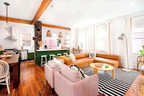 Spacious layout with plush chairs and a sectional—ideal for family hangouts or game nights.