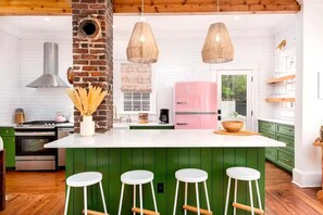 Grab a stool at the large island for morning coffee or cocktails while dinner’s cooking.