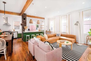 Spacious layout with plush chairs and a sectional—ideal for family hangouts or game nights.