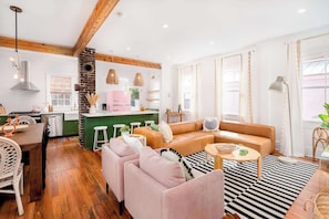 Spacious layout with plush chairs and a sectional—ideal for family hangouts or game nights.