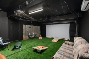Escape to your own private cinema; where cozy sofas, a giant screen, and a cooler create the perfect recipe for an unforgettable movie night!