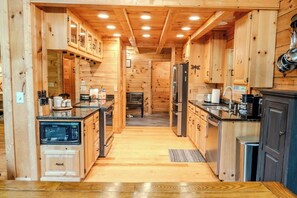 Bright, spacious kitchen with stainless steel
appliances blending modern convenience with cozy charm.