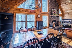 Gather for memorable meals in this elegant dining space
with rustic accents and a warm glow.