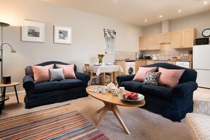 The Bothy at Cheswick - open-plan living area comprising a kitchen, dining area and comfortable sitting room