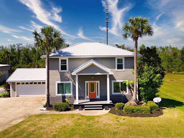 Welcome to Palm Paradise: private heated pool, boat parking, pet friendly with fenced in lawn, catch and release canal on the rear property