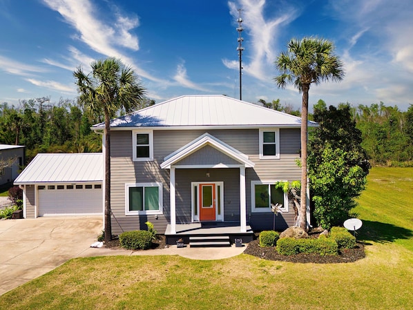 Welcome to Palm Paradise: private heated pool, boat parking, pet friendly with fenced in lawn, catch and release canal on the rear property