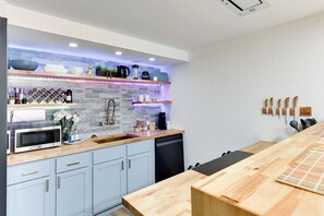 Well Stocked Kitchenette with LED Lighting, Stove, Oven, Fridge and Dishwasher
