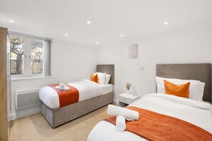 Bright room with two single beds, perfect for sharing