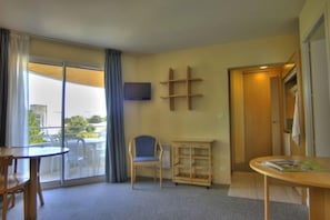 The living area is cozy, the perfect place to relax after a wonderful day.