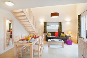 There is loads of room at the dining table and the open concept is always nice for the cook.