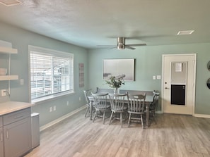 Dining area accommodates 8-9 people