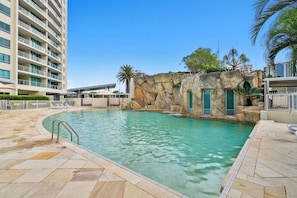 Take a refreshing dip in the lagoon-style pool, perfect for cooling off after a day in the sun.
