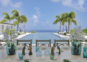 Fully equipped and air-conditioned kitchen. Electric oven, gas stove, microwave, refrigerator, mixer, centrifuge, freezer, dishwasher, Nespresso machine, blender, kettle, toaster, breakfast bar. Outdoor dining area under an ajoupa on the back of the prope