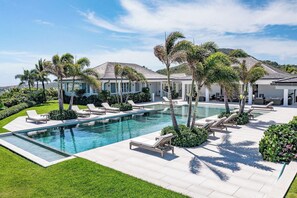 Lush tropical garden surrounding the villa. Private parking at the entrance.