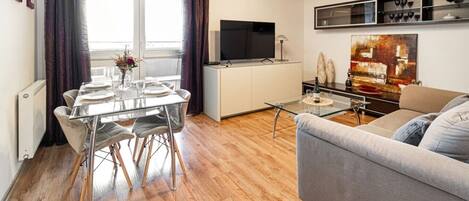 Living Room with Smart TV and Dining Table | Book Now with RENTUJEMY.COM