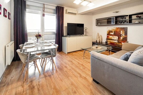 Living Room with Smart TV and Dining Table | Book Now with RENTUJEMY.COM