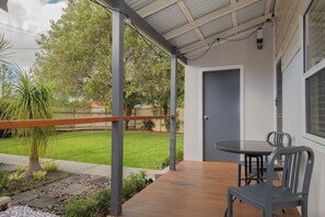 Begin your day with a coffee on the front porch, where soft morning light and garden views create a peaceful, inviting start.