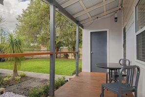 Begin your day with a coffee on the front porch, where soft morning light and garden views create a peaceful, inviting start.
