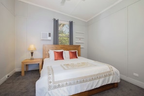 Unwind in the primary bedroom with a queen bed and year-round comfort from split system heating and cooling.