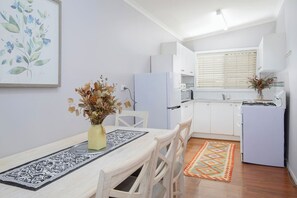 Gather around the five-seater dining table for laid-back lunches or evening chats over a glass of wine.