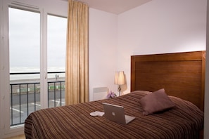Drift to sleep in the comfortable Double bed or 2 Single beds in the bedrooms after a wonderful day outside - let us know what you prefer! (Note: this unit does NOT feature a sea view).