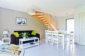 The living area is bright and cozy, perfect for relaxing after a wonderful day.