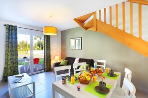 Prepare meals in the kitchenette and enjoy them at the dining table.