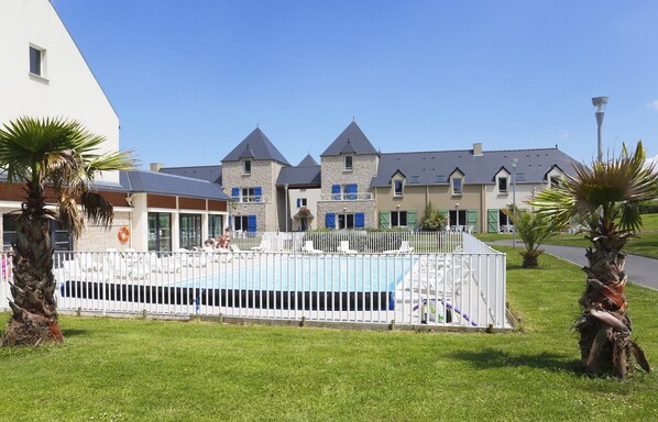 You will love to dive into the pristine outdoor pool on a hot summer day.