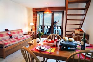 The living area is bright and cozy, perfect for relaxing after a wonderful day.