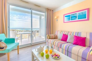 Enjoy sea views from the floor-to-ceiling windows in the living room.