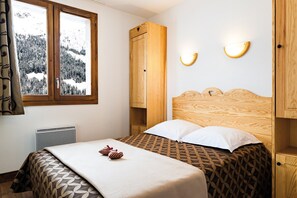 The master bedroom features a cozy Double bed.