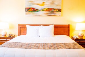 Experience ultimate comfort in the luxurious king-sized bed, styled with plush linens and serene decor, ensuring a restful night’s sleep.