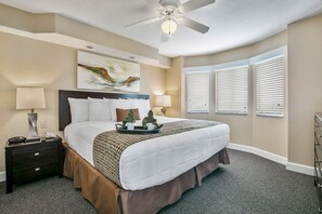 Rest in style within this inviting bedroom featuring a comfortable king-size bed, perfect for a restful night’s sleep after a day of activities.