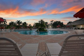Enjoy the picturesque evening skies while lounging by one of the three heated pools surrounded by lush palm trees and inviting cabanas.
