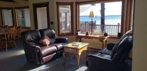 Comfort meets charm in this inviting lounge area, perfect for relaxing after beach days or cozying up by the fireplace.