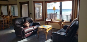 Comfort meets charm in this inviting lounge area, perfect for relaxing after beach days or cozying up by the fireplace.