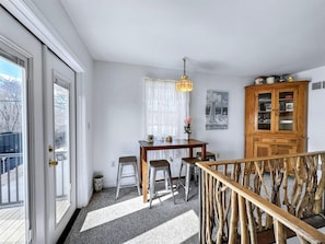 Charming dining nook with natural light and easy access to the deck—perfect for leisurely meals.