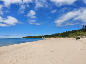 Pristine sugar sand beach just steps away—perfect for a morning stroll or an afternoon swim in Lake Michigan.