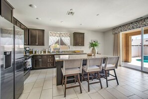 Spacious kitchen island with barstools