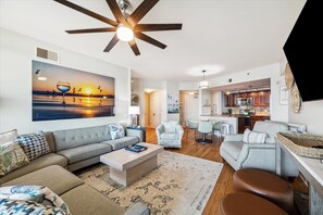 The welcoming living and dining spaces seamlessly connect to the kitchen.