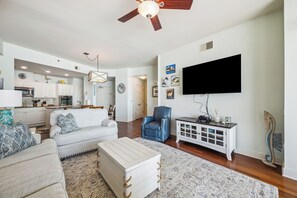 Enjoy a cozy night in with the large wall-mounted TV—perfect for movies, sports, or your favorite beach-day wind-down shows
