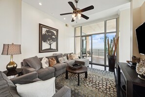 Living room complete with flat screen TV, surround sound stereo, DVD player and plenty of seating.