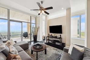 Penthouse Living Area looking towards the balcony overlooking the beach. Light-filled room enjoys views of both the Beach and the Bay.